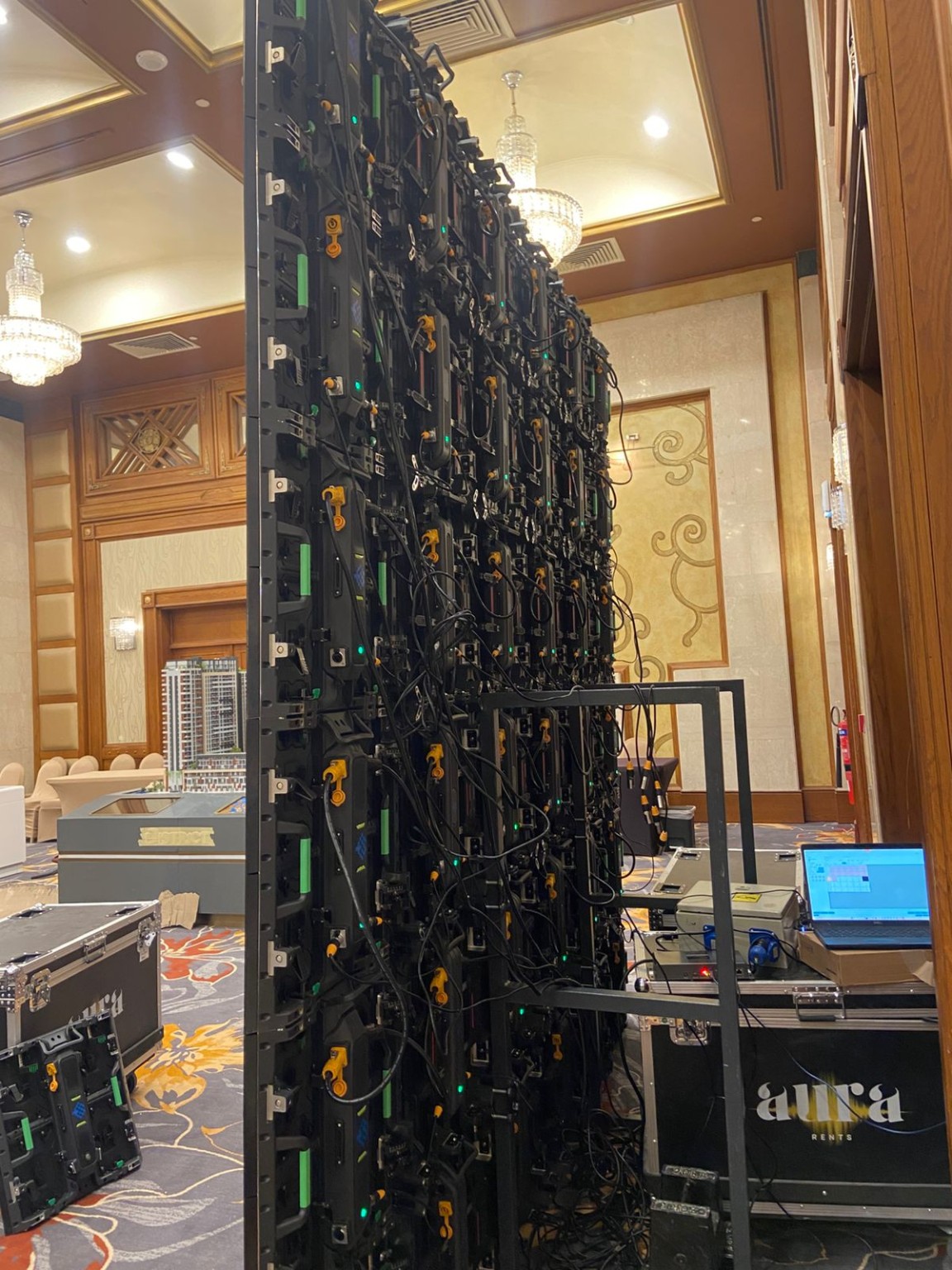 Rear view of LED screen cabinets cabling and support structure at an Al Ain event
